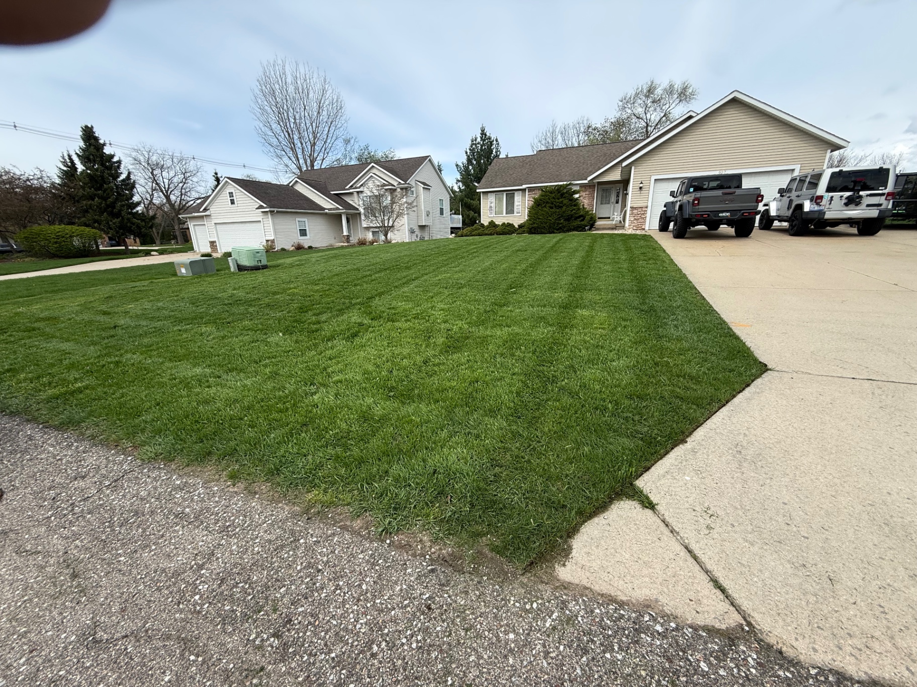 Front Yard Stripe Finish — Lawn Mowing project by Crown Scapes in West Michigan