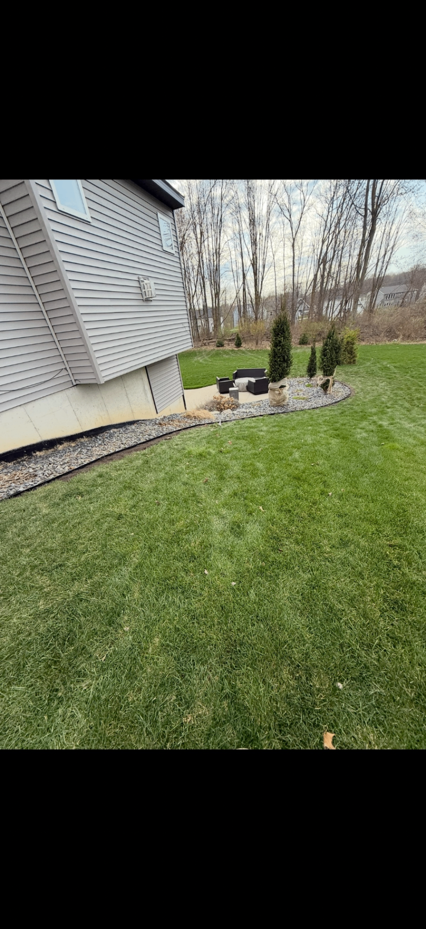 Rock Border & Patio Edge — Rock Install project by Crown Scapes in West Michigan